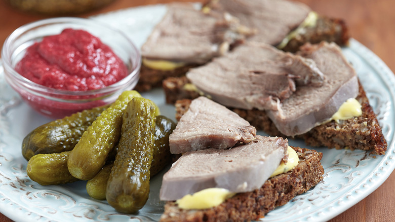 tongue meat with egg salad on bread