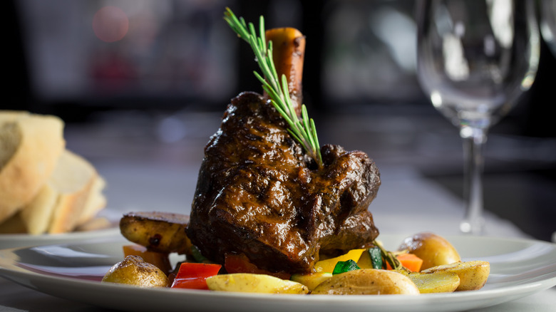 plate of steak potatoes and vegetables at restaurant