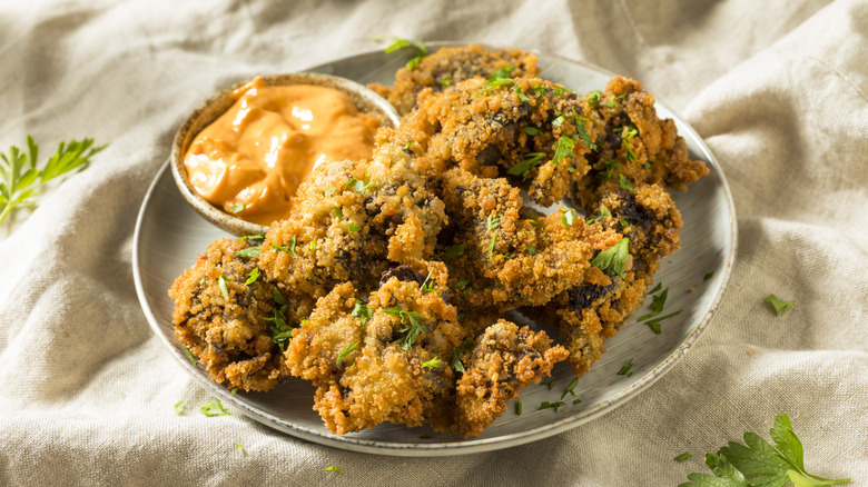 fried chicken livers on plate with dipping sauce