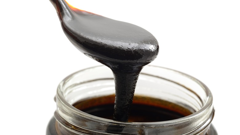 spooning molasses out of jar