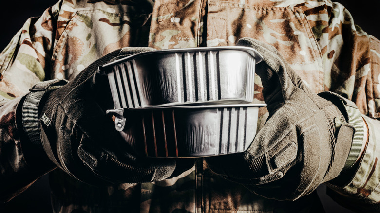 soldier holding MREs