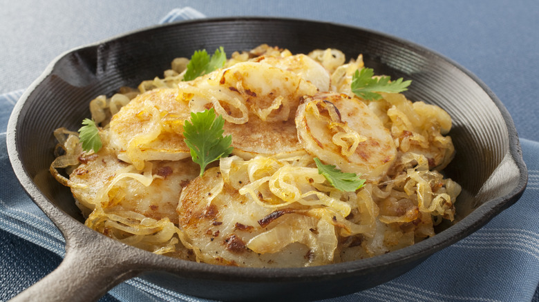 Lyonnaise potatoes in a cast iron skillet
