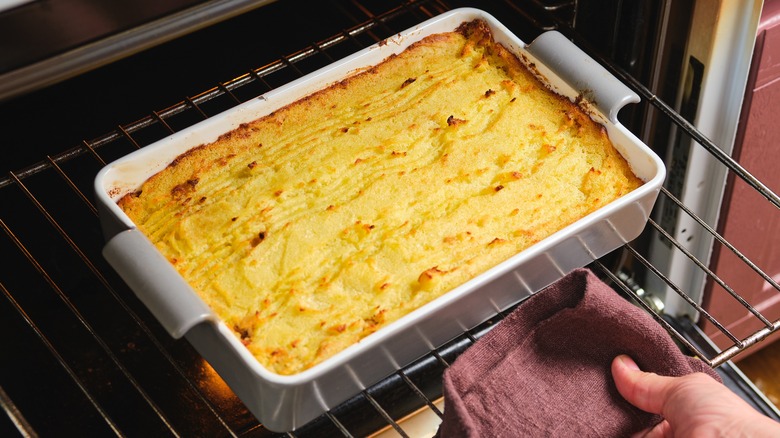 Potato filling being pulled from the oven