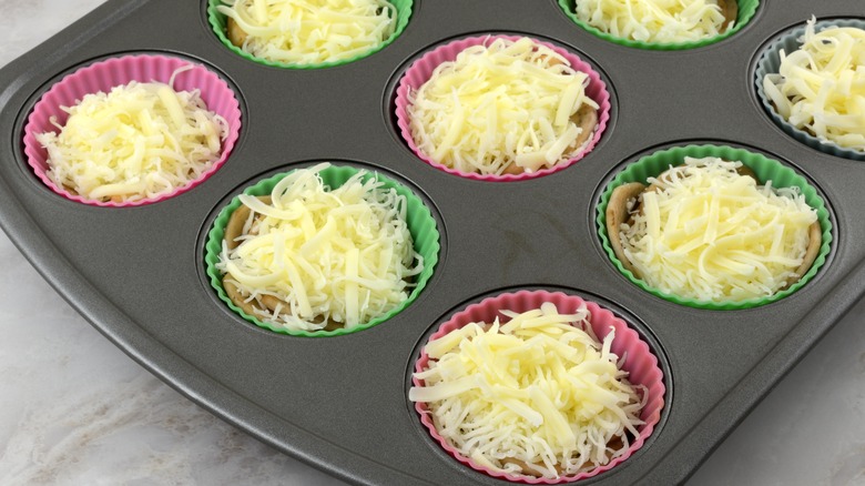 Potatoes and cheese in a muffin pan