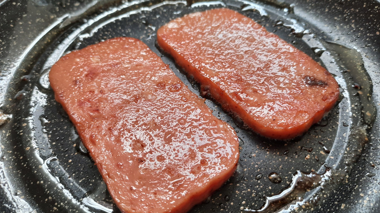fried Spam on a frying pan