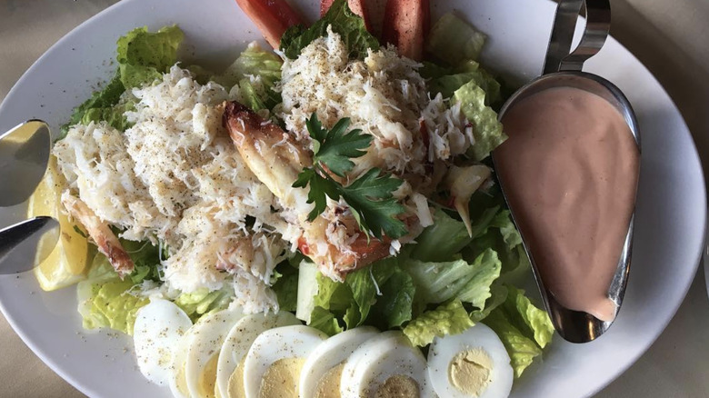 Crab Louie salad with sliced eggs and Thousand Island dressing