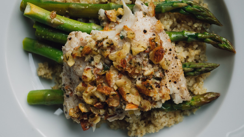 Trout Amandine on a bed of asparagus