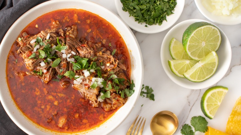 beef birria with lime slices