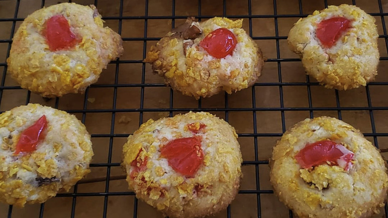 Cherry wink cookies on a cooling rack