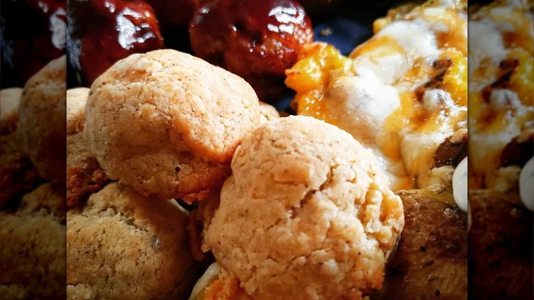 Close-up of baked olive and cheese balls on plate