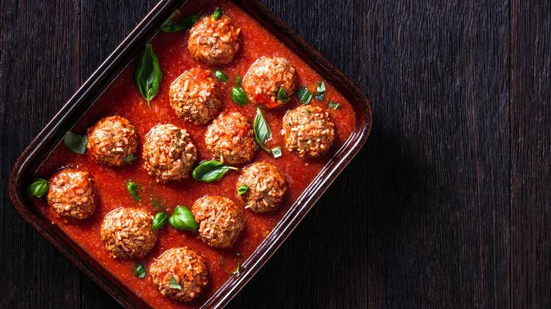Dish of porcupine meatballs on wood table