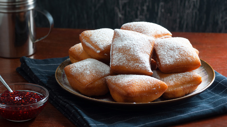 plate of beignets with powdered sugar