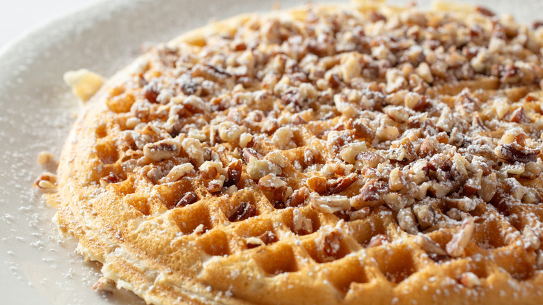 waffle topped with chopped pecans