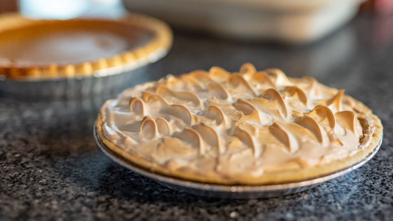 Meringue pie and non-meringue pie in background