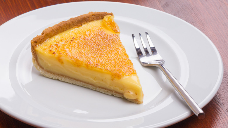 Slice of custard pie on plate