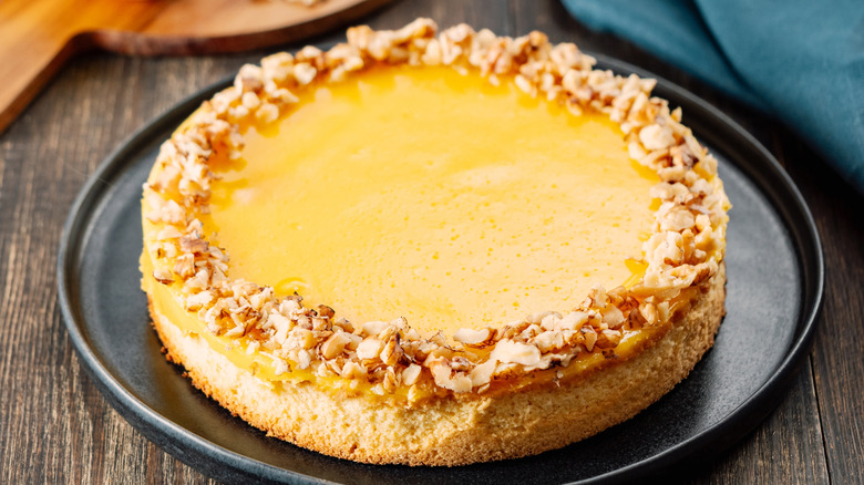 Lemon curd or vinegar pie on black plate wooden table