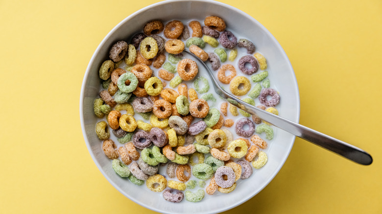 A bowl of Froot Loops in milk with a spoon