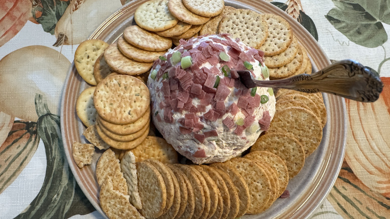 cheese ball with crackers on a plate