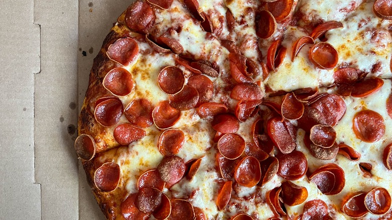 cupping pepperoni on pizza