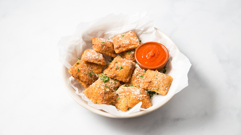 toasted ravioli in serving dish