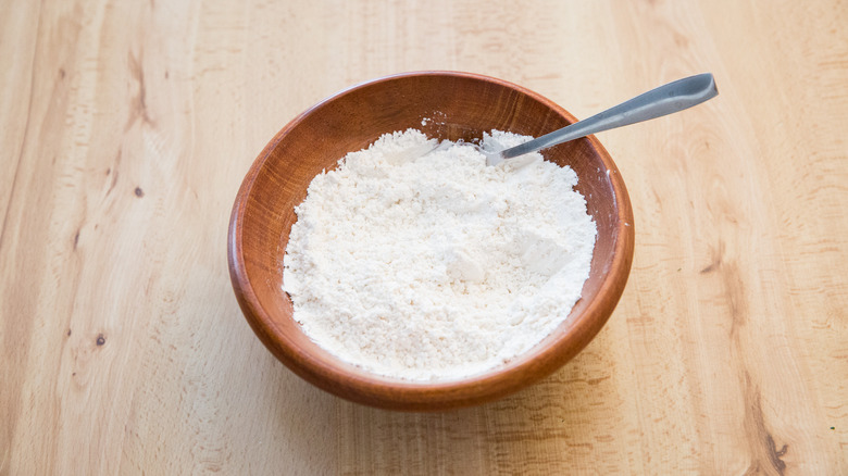 flour in small wooden bowl