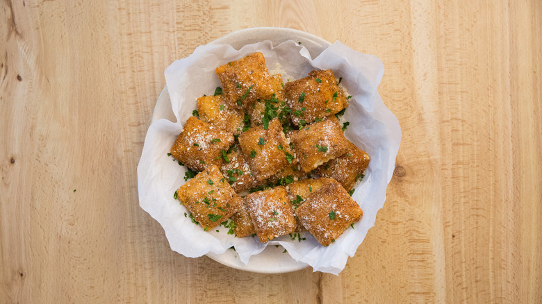 toasted ravioli in serving dish