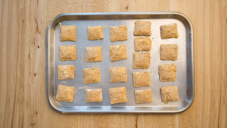 toasted ravioli on baking sheet