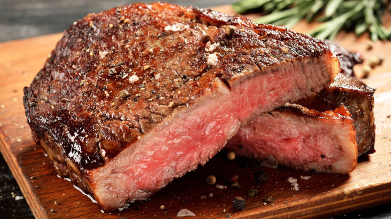 Ribeye steak on wooden board