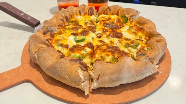 a Colorado style mountain pie pizza on a pizza stone