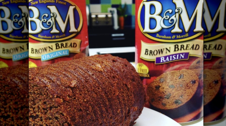 Loaf of canned brown bread with B&M cans
