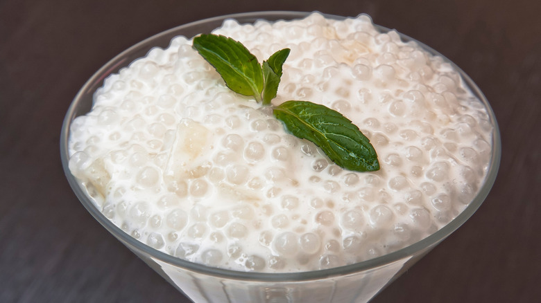 dish with tapioca pudding and mint sprig
