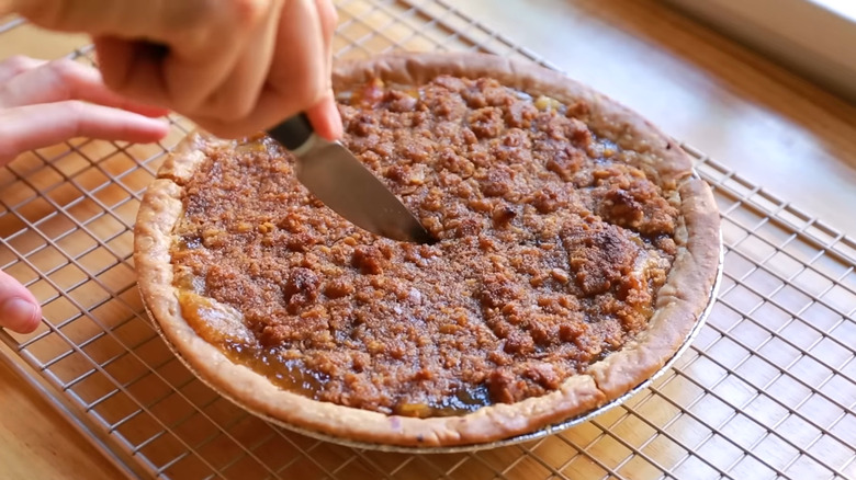 woman cutting mock apple pie
