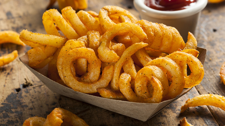 Curly fries in a paper boat