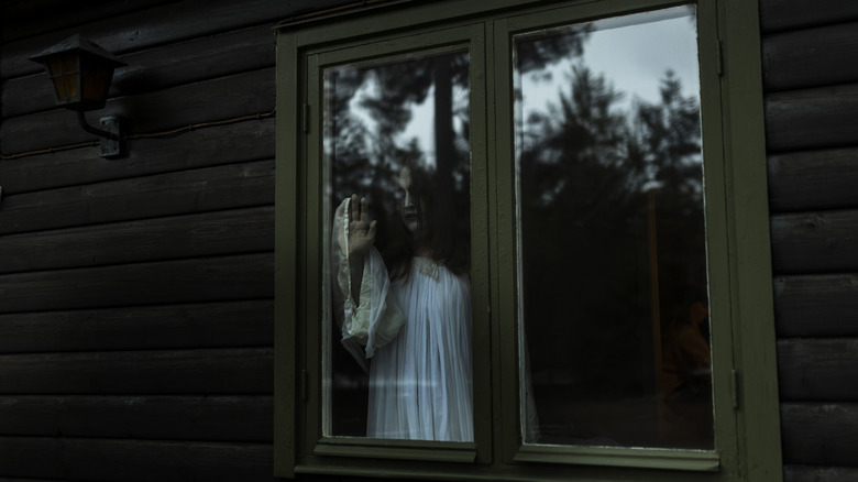Ghostly figure in window
