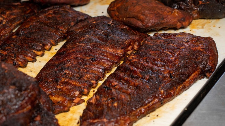 Racks of BBQ ribs on cutting board