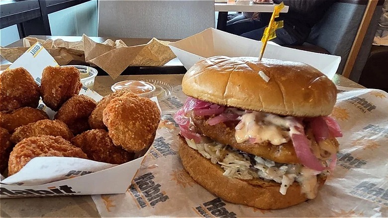 Habit Burger Grill baja crispy fish sandwich with a side of chicken bites