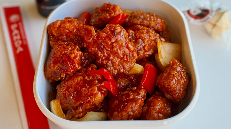 Panda Express Dynamite sweet and sour chicken in white bowl