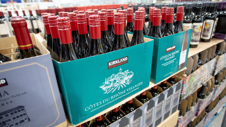 Cases of Kirkland Signature Côtes du Rhône Villages in Costco wine section.