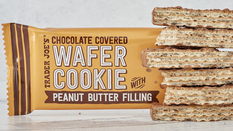 Trader Joe's chocolate-covered wafer cookies with peanut butter filling packaging and stacked cookies.