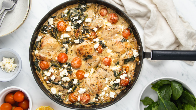 chicken and spinach in pan