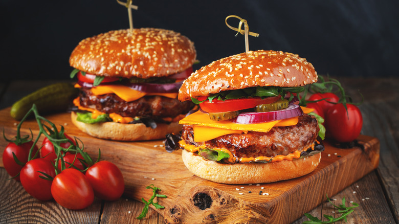 Burgers on a wood plank