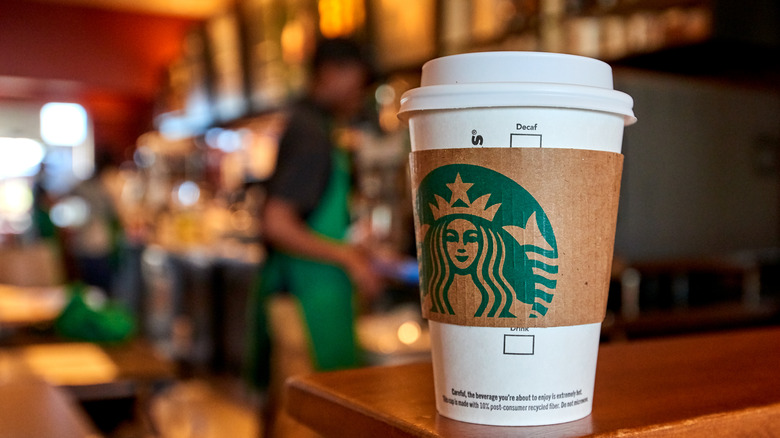 Starbucks cup on counter in store