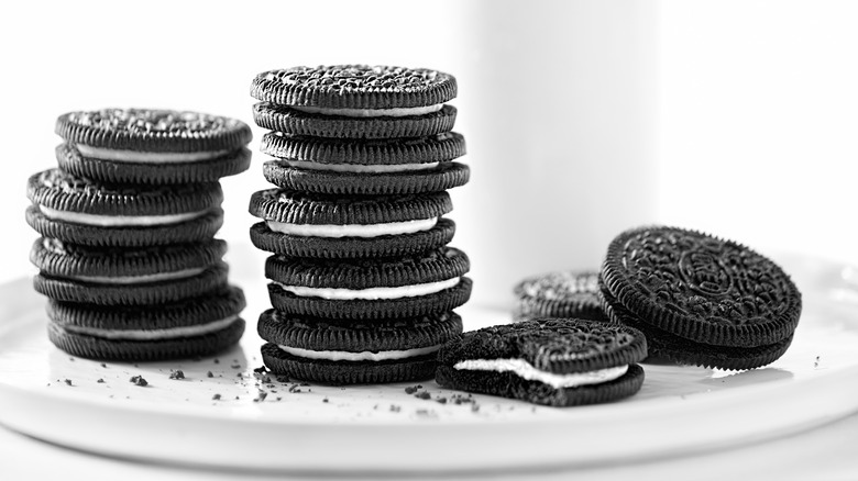 Several stacks of black and white Oreo cookies