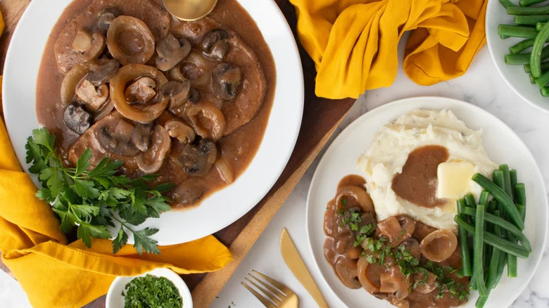 Easy Crock Pot Cubed Steak With Mushroom Gravy on two plates