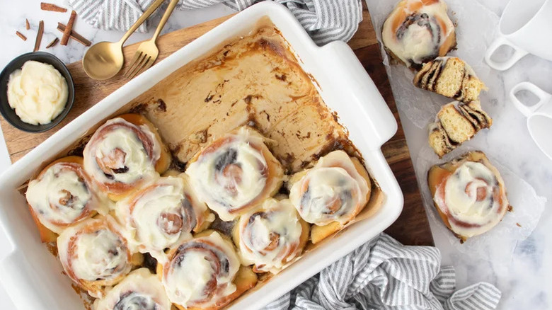 Fluffy Overnight Cinnamon Rolls in a tray with three missing
