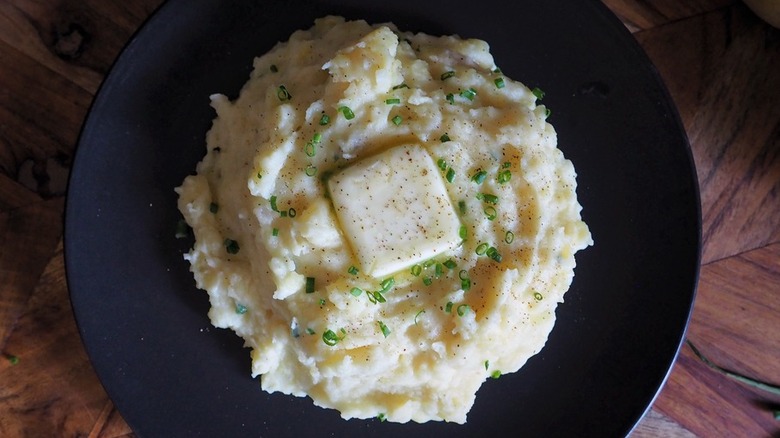 Mashed potatoes, butter, and herbs