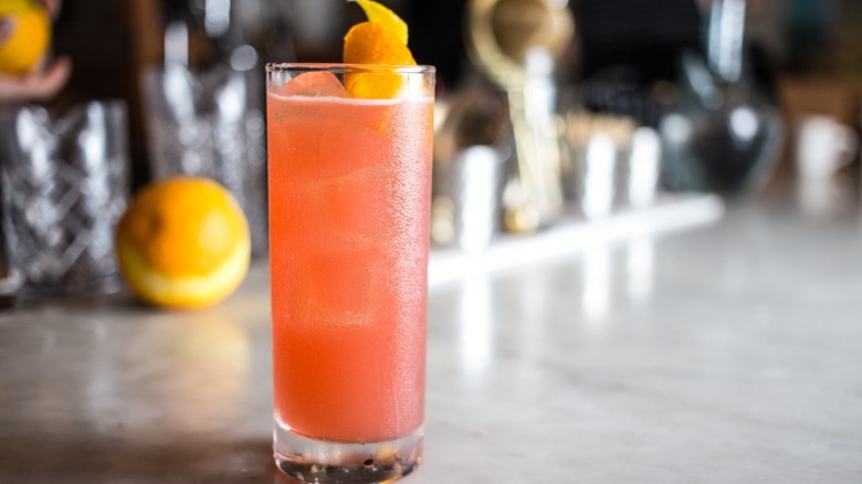 Pink cocktail in a Collins glass