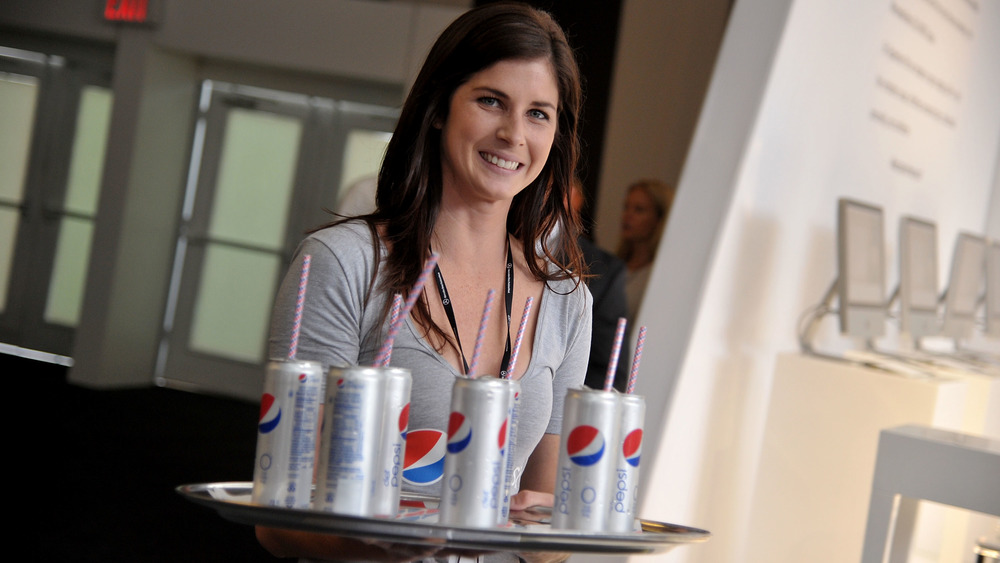 Woman with tray of Diet Pepsis