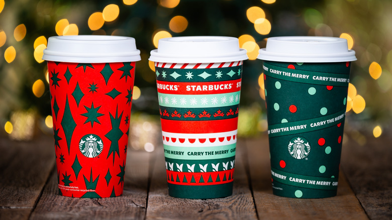 Three starbucks holiday cups