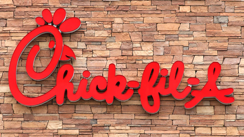 Chick-fil-A logo on a brick wall